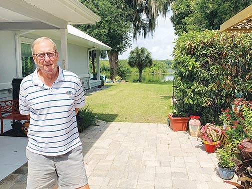 Homeowner David Kudlo stands outside his Satsuma home, which received a certification from the Florida Green Building Coalition last month for its energy efficiency.
