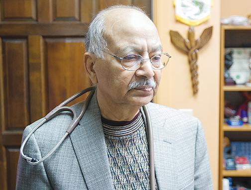 Dr. Iftikhar Ahmad stands in his office days before he entered retirement in 2018.
