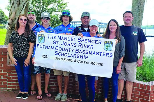 The Putnam County Bassmasters presented $1,000 scholarships to James D. Romig and Coltyn Morris on Friday to help them with expenses in next week’s Bassmaster High School Series National Championship in Tennessee. From left, are Julie Romig, James C. Romig, James D. Romig, Morris, Bassmaster Elite Series pro Cliff Prince of Palatka, Kelley Prince, Ashley Spencer and Coy Spencer. The scholarship is named for Coy Spencer’s father, Manuel Spencer. (WAYNE SMITH / Palatka Daily News)