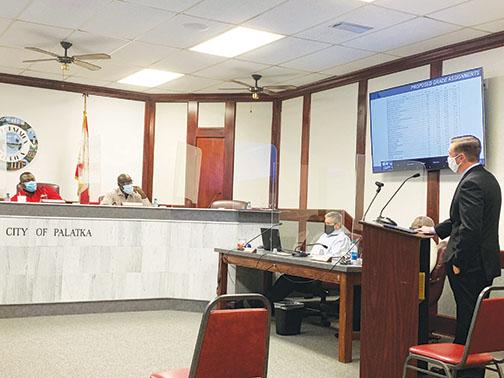 Palatka city commissioners review a salary survey presented by Reward Advisory Group consultant Tom Masters, right, at a budget workshop Thursday.