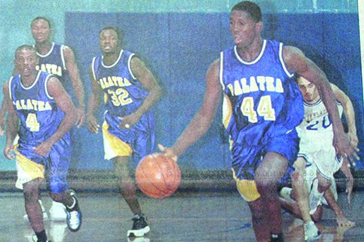 Palatka’s Darcy Johnson brings the ball down the court with teammates (from left), Thadius Crawford, Marion Knowles and Kevis Coley following behind during a game against Interlachen in 2001. (Daily News file photo)