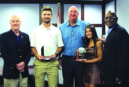 St. Johns River State College baseball pitcher Heston Mosley, second from left, and volleyball libero Dariana Luna, second from right, pose with their College’s 2021 Student Athletes of the Year awards. Sharing in the moment, from left, are SJR State President Joe Pickens, head baseball coach-athletic director Ross Jones and SJR State Vice President for Student Affairs Gilbert Evans. (Submitted / SJRSC)