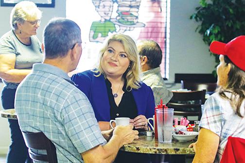 U.S. Rep. Kat Cammack, R-Fla., sits down with Putnam County residents at C P Deli & More in Palatka to listen to their concerns Tuesday morning.