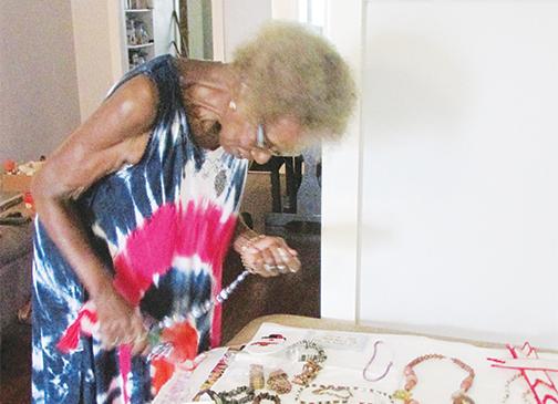 Bettye McPherson of Palatka looks over some of the jewelry and crafts she made. She plans to show some of her craftwork at the Palatka Senior Arts Festival on Sept. 11.