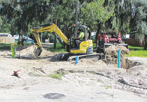 Workers with TB Landmark Construction get ready to place new water lines Wednesday at the intersection of 18th and Oak streets in Palatka as the city continues infrastructure upgrades.