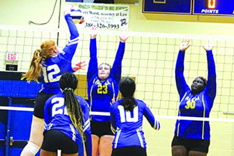 Interlachen’s Payton Alexander (12) delivers a kill in the fifth set against Palatka on Saturday as Palatka’s Riley Kenyon (23) and Torryence Poole (30) try to defend. (MARK BLUMENTHAL / Palatka Daily News)