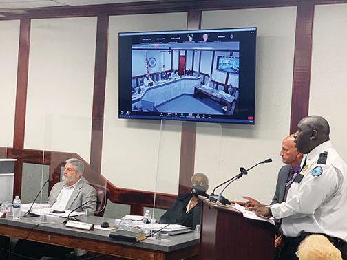 Putnam Correctional Institute Lt. Will Carter, right, and Warden Jeffrey Howell address Palatka city commissioners at Thursday night’s meeting.