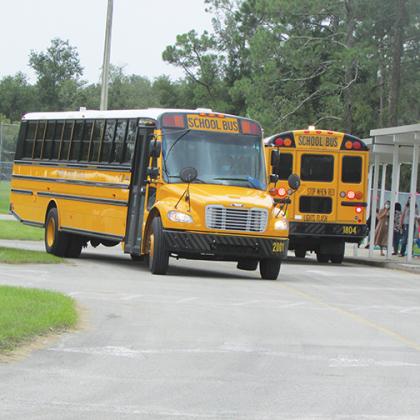 Putnam County School District buses get ready to pick up students Tuesday afternoon at Mellon Learning Center.