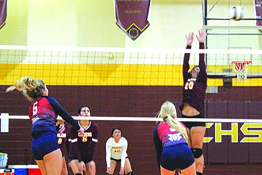 Adrianna Compusano lets loose with a kill attempt against Crescent City’s  Morgan Brady during Thursday’s match won by the visiting Wildcats. (MARK BLUMENTHAL / Palatka Daily News)
