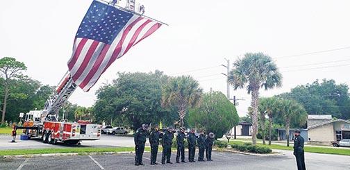 The American flag hangs from a Palatka Fire Department ladder truck prior to Saturday’s ceremony.