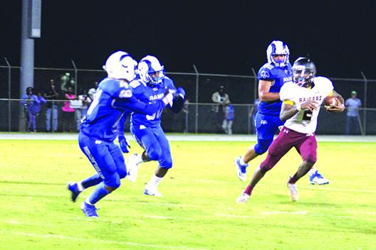Crescent City’s Naykeem Scott (2), who ran for 288 yards in last week’s win over Trenton, tries to escape Interlachen defenders on Sept. 10. (MARK BLUMENTHAL / Palatka Daily News)