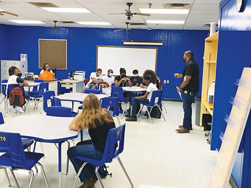 Palatka Junior-Senior High School students, most of whom are wearing masks, receive instruction Aug. 17, the first day of the academic year.