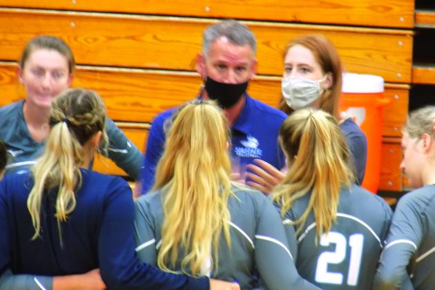 St. Jons River State College volleyball head coach Matt Cohen chats with his player during a recent timeout in a match against Florida State College-Jacksonville. The Vikings host Lake-Sumter in a big JUCO Sun-Lakes Conference matchup tonight. (COREY DAVIS / Palatka Daily News)