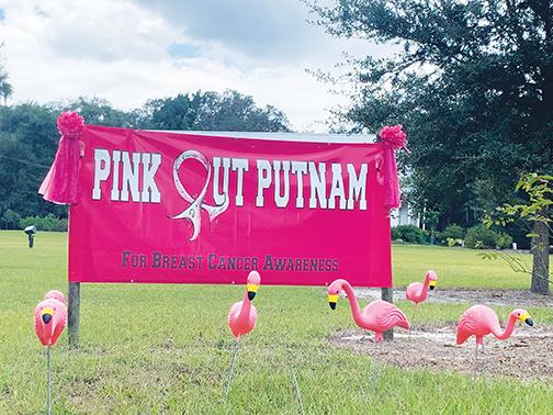 The front lawn of the Woman’s Club of Palatka is festooned with a big pink sign and signature flamingos in observance of October being Breast Cancer Awareness Month.