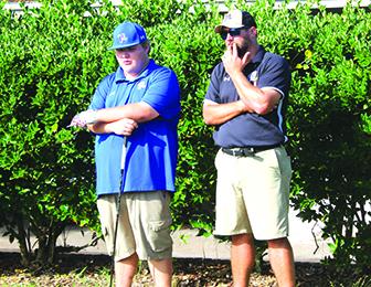 Palatka’s R.J. Symonds (left) talks with head coach Jeff Malandrucco before teeing off on the first hole of Monday’s District 4-2A boys golf tournament. (MARK BLUMENTHAL / Palatka Daily News)