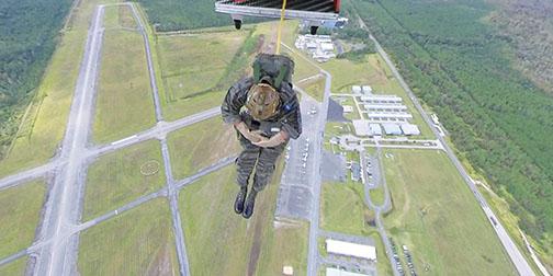 Jumpmaster John Hoffstetter is the first person to exit the Casa 212 aircraft over Skydive Palatka at Kay Larkin field in Palatka.