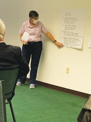 Crescent City resident Tracy Eckhardt outlines her group’s findings during a strategic plan input session at City Hall on Wednesday.