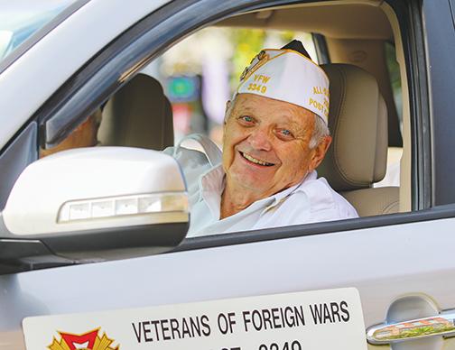 Gerald Donnelly, post commander for Veterans of Foreign Wars Post 3349, smiles widely during the Veterans Day parade on St. Johns Avenue on Thursday.