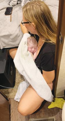 Makayla Ortega holds her newborn boy, Silas Ortega, the morning of Nov. 8 in her home where she gave birth.