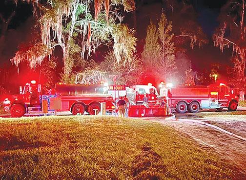 Emergency vehicles arrive to extinguish a fire in Palatka