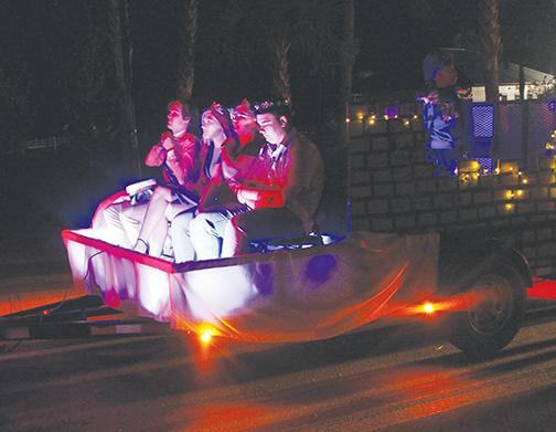 Members of a local church group ride in a float during the 2019 Palatka Christmas Parade.