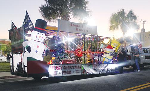 A dance team’s float sits in the staging area ahead of the start of the 2019 Palatka Christmas Parade.