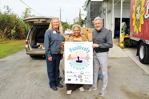 Sheila McCoy of Palatka Christian Service Center accepts Thanksgiving turkeys for clients of her organization from Hitchcock’s Manager Missy Hall, left, and Michael Leonard, Palatka Daily News.