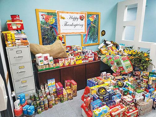  A figurative and literal cornucopia of food is splayed throughout one of the health department offices ahead of Thanksgiving. 