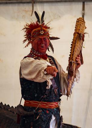 A re-enactor portraying Long Warrior, King of the Seminole Tribe, calls on Putnam County second-graders Thursday who had questions about life in the 1700s. 