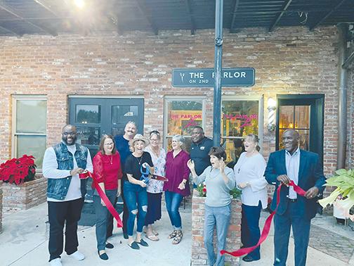 Palatka city officials celebrate new Second Street business the Parlor on 2nd with a ribbon-cutting this week.