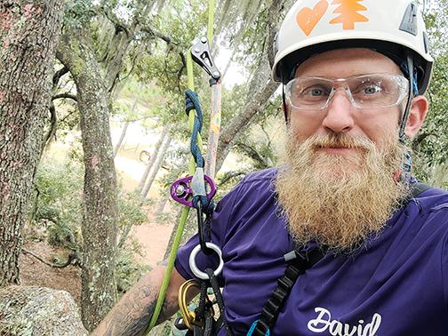 Climber David Loats snaps a selfie while testing the equipment in preparation for Treeapalooza, a three-day event that took a week to set up on property off of West State Road 20.