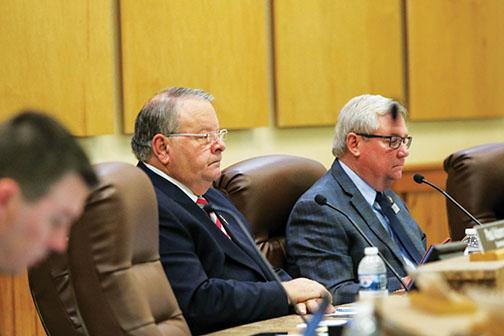 County Commissioners Terry Turner and Bill Pickens listen to comments Tuesday during the Board of County Commissioners meeting.