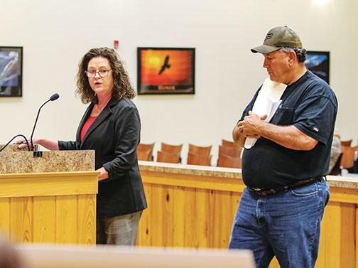 St. Augustine lawyer Kathryn Whittington and Hog Waller owner Skeet Alford speak before the Putnam County Board of Commissioners on Tuesday.