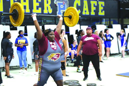 Crescent City’s Paris Clemons delivers a 115-pound lift at the unlimited weight class during the meet. (COREY DAVIS / Palatka Daily News)