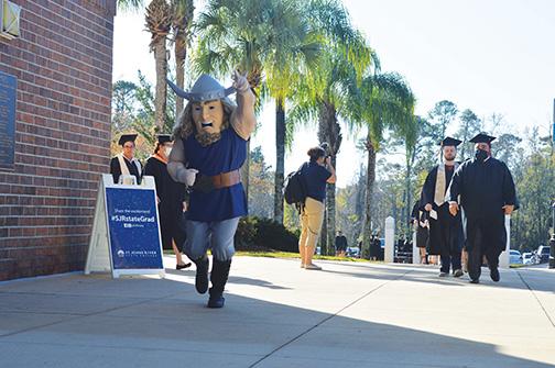 The school’s Viking mascot charges through the Orange Park campus ahead of the commencement ceremony.
