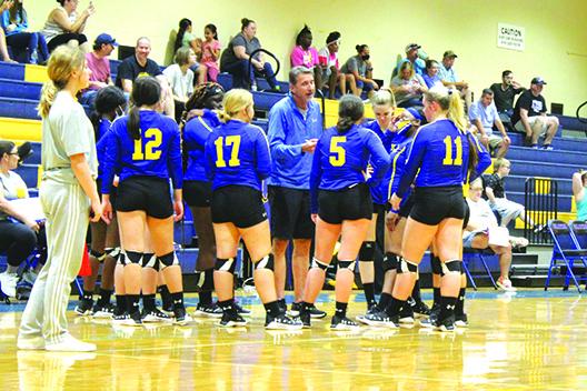 Palatka volleyball coach Robert Bush, here talking to his players during a timeout on Sept. 4 against Interlachen in the county tournament, led his team to its most wins (eight) since the 2004 season. (MARK BLUMENTHAL / Palatka Daily News)
