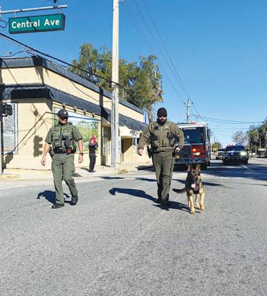 Putnam County Sheriff’s Office deputies walk with K-9 Jaeger in Crescent City’s Martin Luther King Jr. parade on Monday morning.