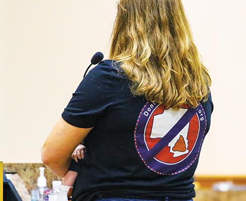 A local resident wears a shirt that reads “don’t poop on Putnam” as a sign of her opposition of biosolids being dumped in South Putnam County.