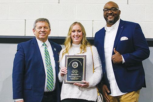Putnam County School District Teacher of the Year Asia Kellner stands between Superintendent Rick Surrency, left, and Moseley Elementary School Principal Tony Benford on Friday after being recognized as the countywide winner.