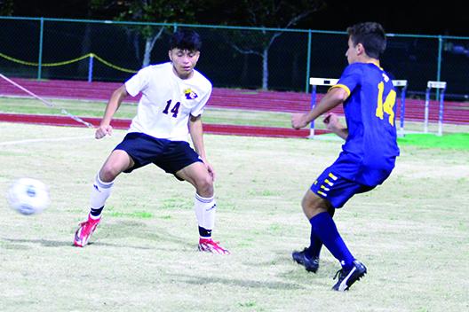 Crescent City's Angel Consuelos (left) battles for the ball with Trinity Prep's Nicholas Torres during Trinity Prep's 5-1 victory over Crescent City in the District 5-3A championship. (MARK BLUMENTHAL / Palatka Daily News)