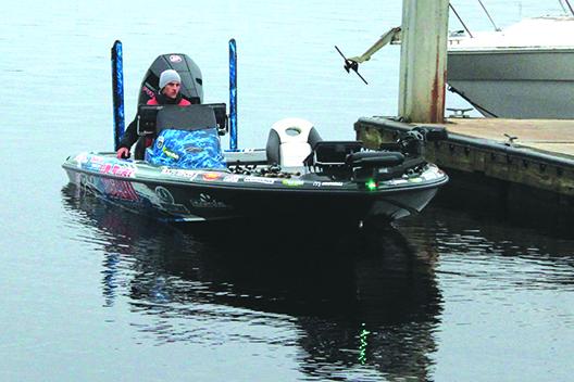 Competitive angler Brandon Cobb of Greenwood, South Carolina, rides his boat toward the dock. (MARK BLUMENTHAL / Palatka Daily News)