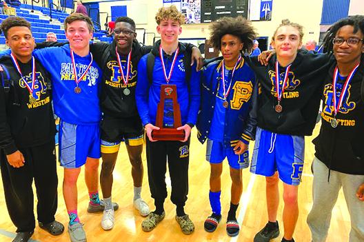 Region 1-1A qualifiers (from left) Mikade Harvey, Gatlin Carreras, Johnson Session, Brandon Lewis, Ishmael Foster, Alexander McCrystal and Demaris Carr pose with the District 4-1A second-place trophy. (COREY DAVIS / Palatka Daily News)