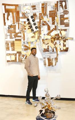 The art of Emmanuel Manu Opoku, seen here, will be featured in an exhibit Friday evening at the Larimer Arts Center in Palatka.