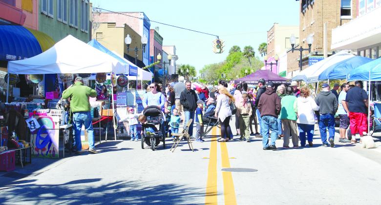 File photo. Crowds gather on St. Johns Avenue in March 2020 as they visit vendors during the 74th Azalea Festival. 