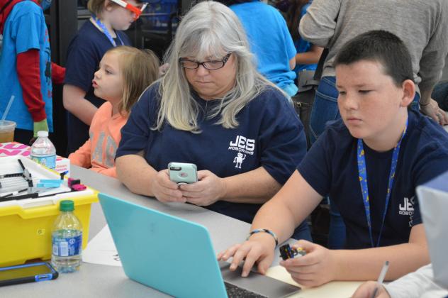 Twelve-year-old Athan Green concentrated intently on a laptop screen at the FIRST LEGO League Qualifying Tournament at Palatka High School on Saturday.