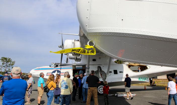 People wait in line to explore a PBY Catalina on Saturday at the Palatka Municipal Airport. 