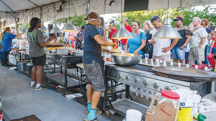 Food vendors prepare and serve food to some of the thousands of people who attend the 2019 Blue Crab Festival in Palatka.