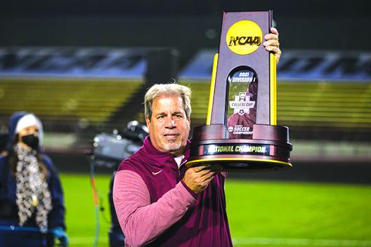Coach Mark Krikorian stands with the NCAA Division I championship trophy after his Florida State University women’s soccer team outlasted Brigham Young for the title in December. (Submitted / Florida State Sports Information Department)
