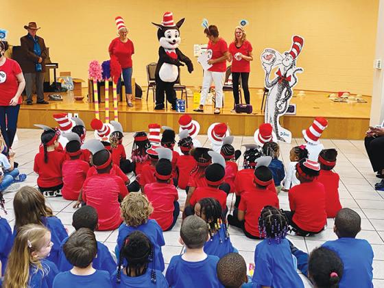 Children enjoy a reading of The Cat in the Hat at Ravine Gardens State Park in Palatka as part of the Early Learning Coalition’s Early Literacy Outreach Program.