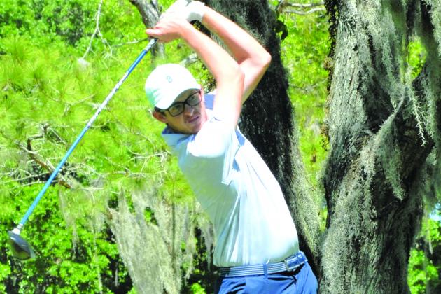 Cody Carroll of Middleburg hits his drive off the No. 11 tee on his way to winning the 65th Azalea Amateur Golf Tournament Sunday at Palatka Municipal Golf Course. (GREG WALKER / Daily News correspondent)